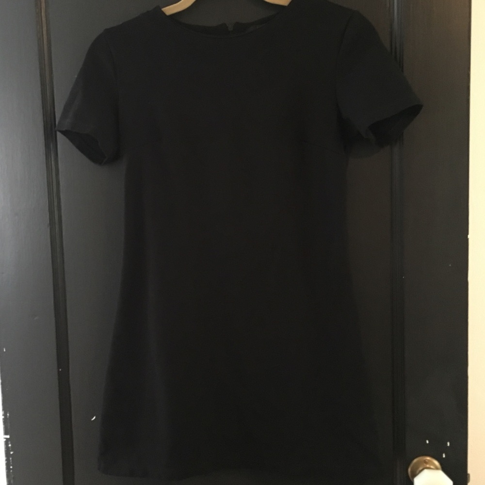 Form-fitted short black dress